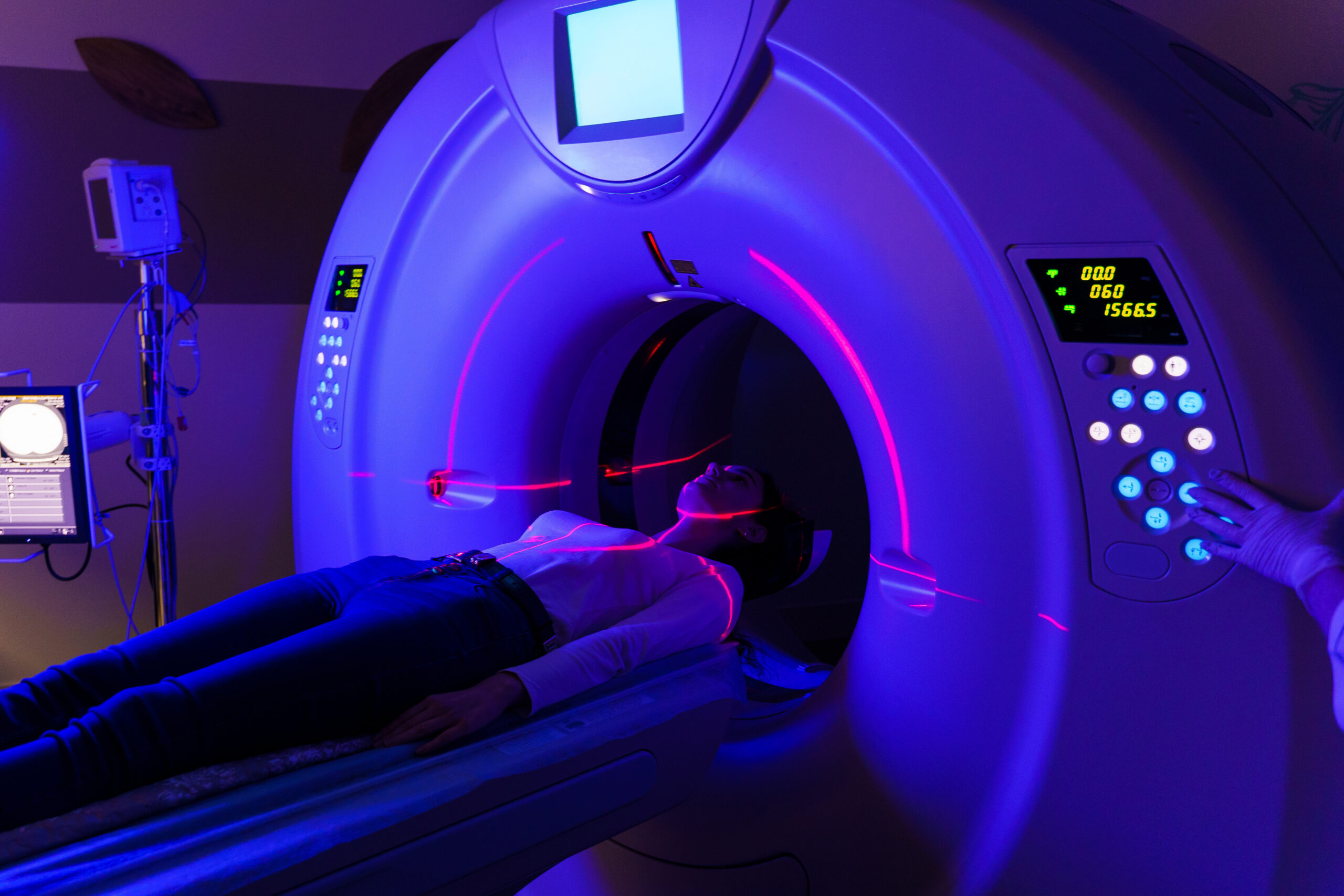 CT of joints in a clinic with blue color and red scanning laser. computer diagnostics of injuries, inflammatory and dystrophic joint diseases for girl